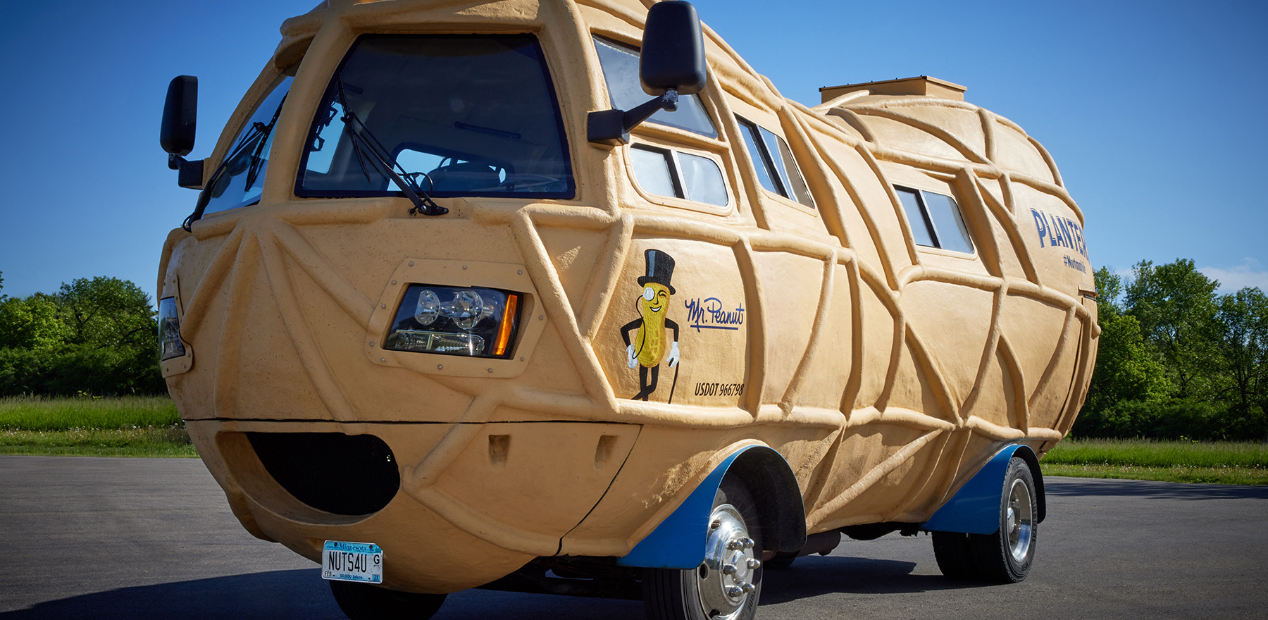 An angled view of the Nutmobile in a parking lot on a sunny day